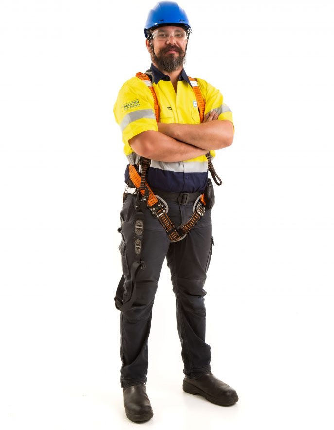 Technician in full fall-arrest harness and hard hat