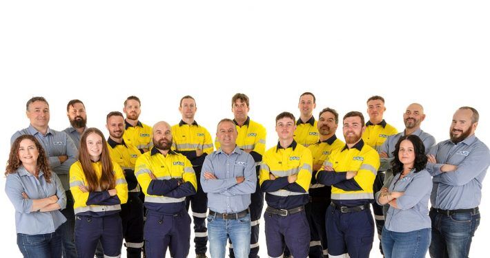 EAS Waikato team standing together in hi-vis and branded workwear